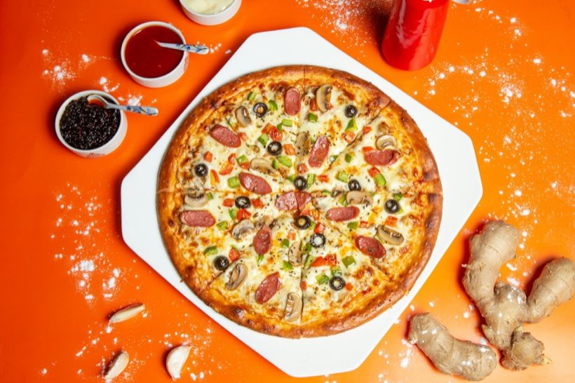 Original Combination pizza with pepperoni, ham, sausage, mushrooms, and olives at Fat Duck's Pizza in South Sacramento