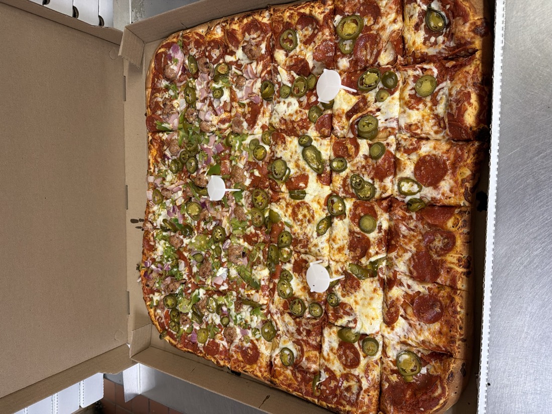 36 slice Team pizza with pepperoni and jalapenos cut into squares at Fat Duck's Pizza Sacramento